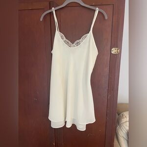 Ivory colored slip blouse, loop straps, lace neckline detail. By Josie size M